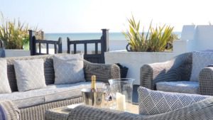 New England Luxury Beach House West Sussex outdoor seating for family beach holidays